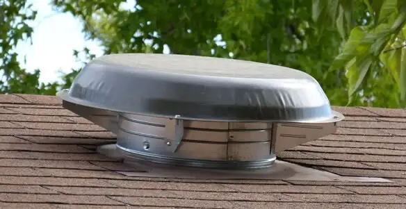 attic fan installation services with low-profile roof ventilation unit in Miami, FL