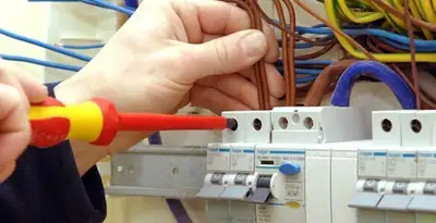 electrician services performing professional electrical panel wiring and connections in Miami, FL
