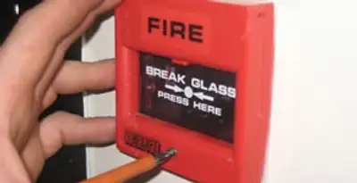 fire alarm installation service showing manual fire alarm pull station installed by licensed electricians in Miami, FL