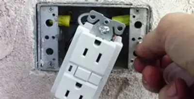 gfci circuits service showing installation of a ground fault circuit interrupter outlet by licensed electricians in Miami, FL