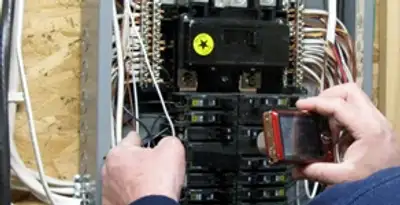 Home electrical inspection of circuit breaker panel by licensed electrician in Miami, FL