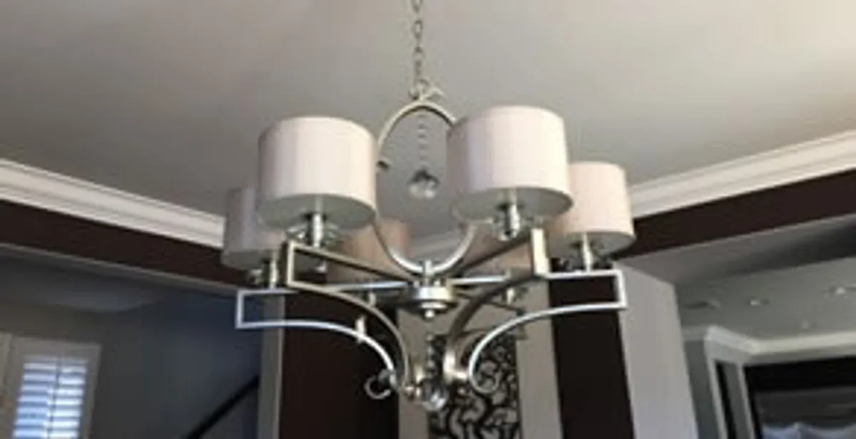 Modern chandelier installation with multiple light fixtures in Miami, FL