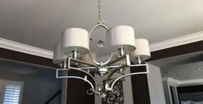 Modern chandelier installation with multiple light fixtures in Miami, FL
