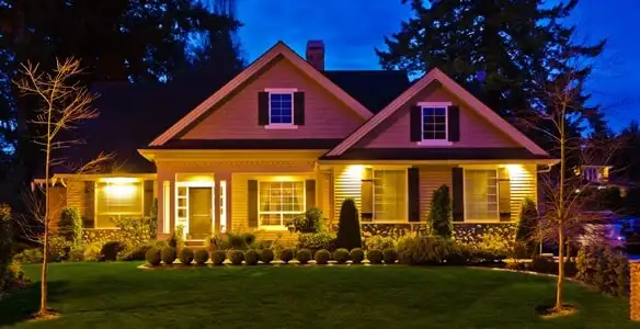 security light installation services illuminating a residential exterior at night in Miami, FL