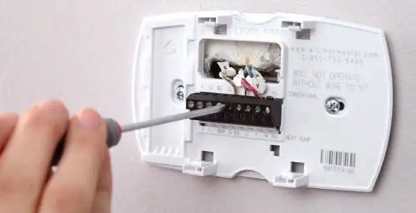 Thermostat installation service with proper wiring and secure wall mounting in Miami, FL